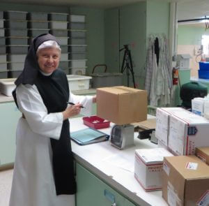 Sister Rita in the shipping department today