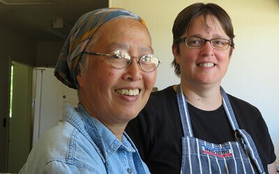 Two nuns are standing in the kitchen of an abbey in Arizona where they make altar bread